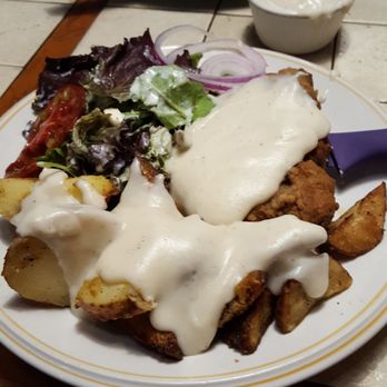 Garden Cafe - Chicken Fried Steak with green salad and a half plate full of roasted potatoes  - thick cream gravy. - Breakfast & Brunch Near Me - Dallas, Texas