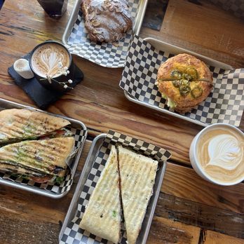 Cajé Coffee Roasters - Haley St - Panini, bagel, almond croissant, cappuccino, cortado, and the Yemen. - Coffee Roasteries Near Me - Santa Barbara, California