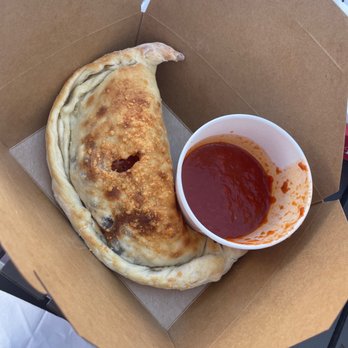 Tomatina - Calzone with marinara sauce. - Italian Near Me - Roseville, California Tomatina - Calzone with marinara sauce. - Italian Near Me - Roseville, California