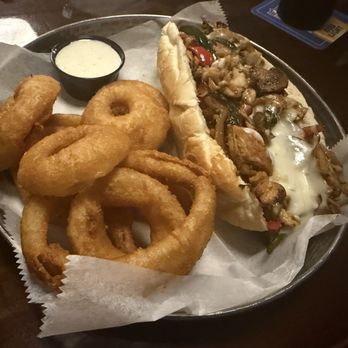 Tap Room - Chicken Philly with onion rings - Pubs Near Me - Greensboro, North Carolina Tap Room - Chicken Philly with onion rings - Pubs Near Me - Greensboro, North Carolina