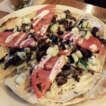 Aladdin's Eatery - Shawarma pitza is tasty and interesting to eat. I like the combination of grilled meat, cucumbers, tomatoes and light tahini yogurt dressing - Mediterranean Near Me - West Chester, Ohio Aladdin's Eatery - Shawarma pitza is tasty and interesting to eat. I like the combination of grilled meat, cucumbers, tomatoes and light tahini yogurt dressing - Mediterranean Near Me - West Chester, Ohio