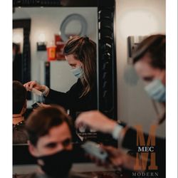 Mec Modern Barbering - Our barber, Eleigha doing a haircut for her client.