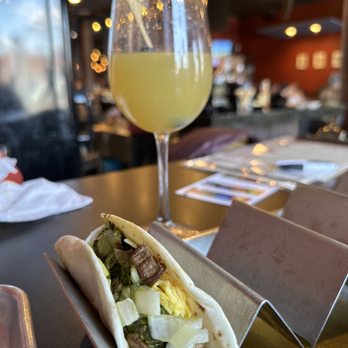 Whiskey Taco Foxtrot - Their steak and eggs breakfast burrito and a mimosa - Whiskey Bars Near Me - Clawson, Michigan Whiskey Taco Foxtrot - Their steak and eggs breakfast burrito and a mimosa - Whiskey Bars Near Me - Clawson, Michigan