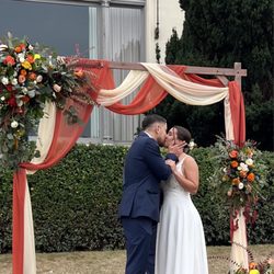 Magda's Flowers - Wedding Arch draping and flowers from Magda's Flowers.
