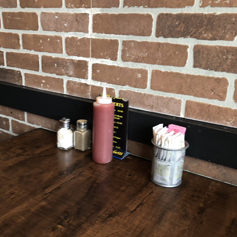 Naomi's Grill - a ketchup and condiments on a table - Salad Near Me - Prince Rupert, British Columbia Naomi's Grill - a ketchup and condiments on a table - Salad Near Me - Prince Rupert, British Columbia