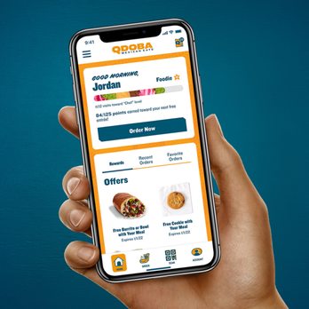 Qdoba Mexican Eats - a hand holding a phone - Mexican Near Me - Eagan, Minnesota Qdoba Mexican Eats - a hand holding a phone - Mexican Near Me - Eagan, Minnesota