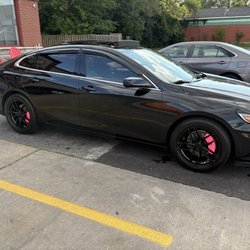Black Malibu after a wash at raceway.
