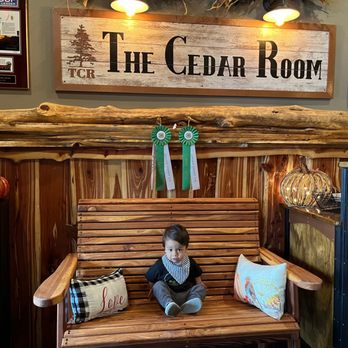The Cedar Room - a young boy sitting on a bench - Steakhouses Near Me - North Platte, Nebraska The Cedar Room - a young boy sitting on a bench - Steakhouses Near Me - North Platte, Nebraska