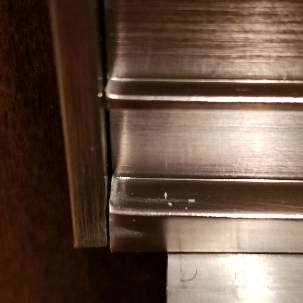 Rikman Services - LEFT SIDE VIEW OF "SPECIAL ORDERED TRIM KIT" THAT IS WAY TOO LARGE.  HANGING OVER OVEN FRAME. TRIM KIT IS NOT SYMMETRICAL AT ALL. - Electricians Near Me - Conroe, Texas