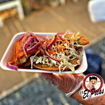 Tortas Ahogadas El Pecas - a hand holding a plate of food - Mexican Near Me - Commerce, California Tortas Ahogadas El Pecas - a hand holding a plate of food - Mexican Near Me - Commerce, California