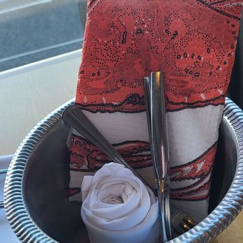 Anthony's at Spokane Falls - Items to eat crab. Napkin, cracker, fork, seafood bib, bowl - Seafood Near Me - Spokane, Washington