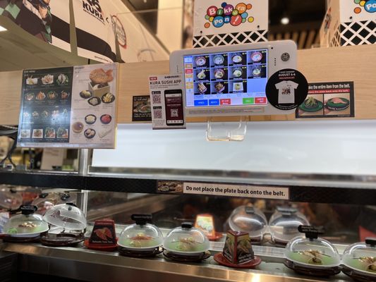 Kura Revolving Sushi Bar by null