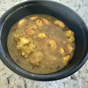 Pimento Palace Catering Services - Curried shrimp in their takeaway bowl - Caterers Near Me Pimento Palace Catering Services - Curried shrimp in their takeaway bowl - Caterers Near Me