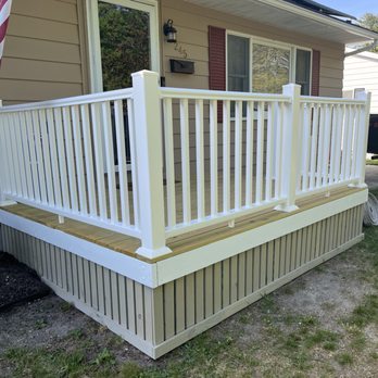 David Home Solutions - a porch with railings - General Contractors Near Me