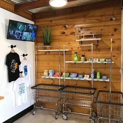 Hang N' Dry Laundromat - Front entrance with laundry detergent for sale