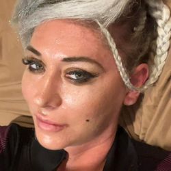 Abass Denver Hair Braiding - Blonde and silver extensions woven in with three corn rolls on either side of the head. Bangs are kept loose for volume. Ask for Alicia!
