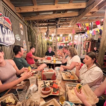 Yellow Dog Eats Kitchen & Bar - Covered Outdoor and Indoor seating at Yellow Dog seats nsb - Bars Near Me - New Smyrna Beach, Florida