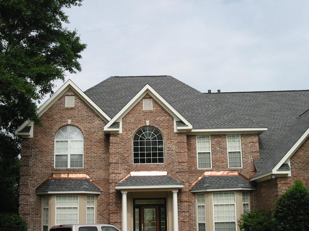 Slide of Total Quality Roofing