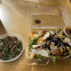 Jerk chicken bowl with a side of kale salad