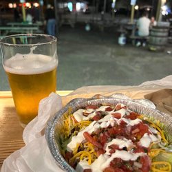 Southport Tap and Cellar - Hofbräuhaus beer and low car burrito bowl from the taco truck. View of outdoor seating area from indoors.