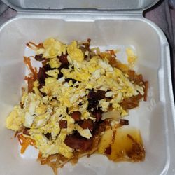 That Flippin' Egg - Drowned in grease, burned tomatoes and onions.