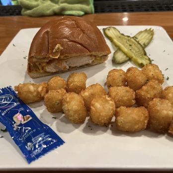 Kenny's Westside Pub - Chicken Sandwich in half with tater tots - American Near Me - Peoria, Illinois