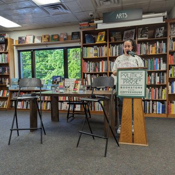 Politics and Prose - a man speaking at a podium in a library - Bookstores Near Me - Washington, DC, District of Columbia