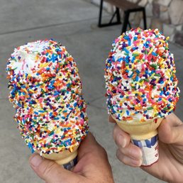 Large & small vanilla cone with rainbow sprinkles