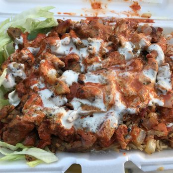 Food Time Halal - Lamb and chicken combo over rice with white and red sauce - Street Vendors Near Me - Elmhurst, New York Food Time Halal - Lamb and chicken combo over rice with white and red sauce - Street Vendors Near Me - Elmhurst, New York