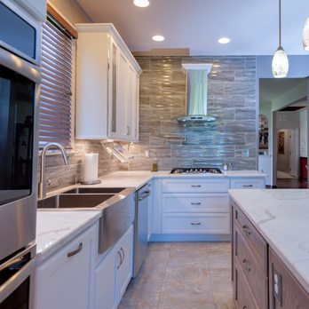 Samuels Construction - a kitchen with marble countertops and stainless steel appliances - General Contractors Near Me - Trenton, New Jersey Samuels Construction - a kitchen with marble countertops and stainless steel appliances - General Contractors Near Me - Trenton, New Jersey