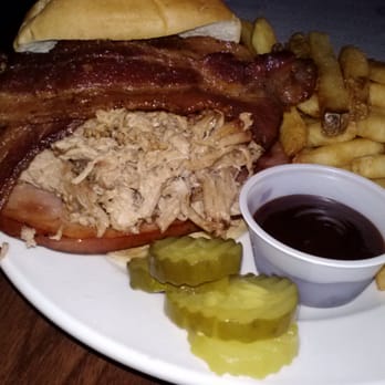 Checkered Flag Tavern - The Big Pig Sandwich! Pulled pork, topped with smoked ham, then strips of bacon with BBQ sauce & pickles on side. Delicious! - Pubs Near Me - Indianapolis, Indiana