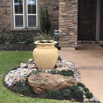 SCAPES ENVIRONMENTAL DESIGN - a planter in front of a house - Landscaping Near Me - Porter, Texas SCAPES ENVIRONMENTAL DESIGN - a planter in front of a house - Landscaping Near Me - Porter, Texas