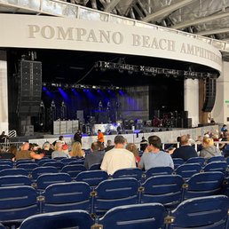 people sitting in blue chairs