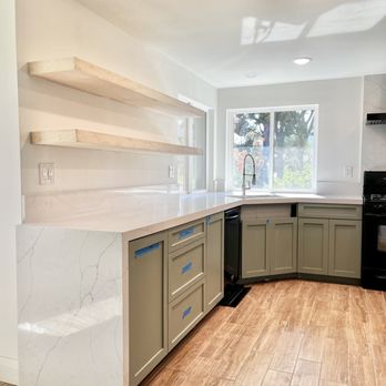 Numark - Installed new quartz backsplash & counters with waterfall. New cabinets and sink, faucet. Custom floating shelves - General Contractors Near Me Numark - Installed new quartz backsplash & counters with waterfall. New cabinets and sink, faucet. Custom floating shelves - General Contractors Near Me