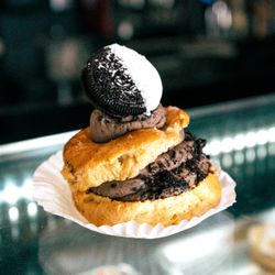 Breaüxdoo Bakery - One of our specialty Cream Puffs, filled with chocolate and topped with a chocolate dipped Oreo.