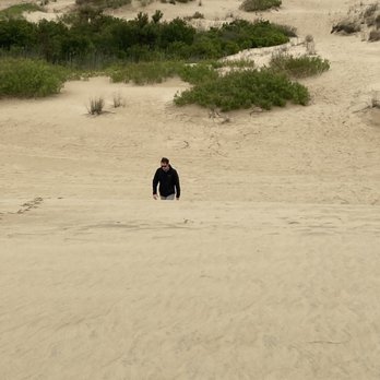 Jockey's Ridge State Park - Climbing a sand dune at Jockey's Ride State Park on a windy day - Parks Near Me - Nags Head, North Carolina Jockey's Ridge State Park - Climbing a sand dune at Jockey's Ride State Park on a windy day - Parks Near Me - Nags Head, North Carolina