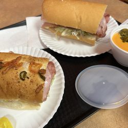 Sid’s Deli & Subs - Italian sub on left, Sid's Special on right. Also we got tortilla chips and cheese sauce with jalapeños.