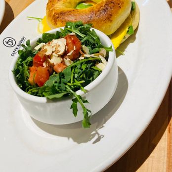 Caffé Buondí - Bagel with arugula almond salad - Breakfast & Brunch Near Me - Carmel, Indiana Caffé Buondí - Bagel with arugula almond salad - Breakfast & Brunch Near Me - Carmel, Indiana