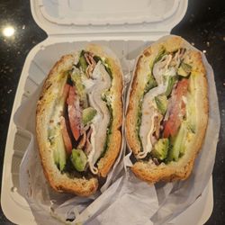 T Bagel Cafe - California croissant sandwich packed with avocado, sliced turkey, tomatoes, lettuce, etc.