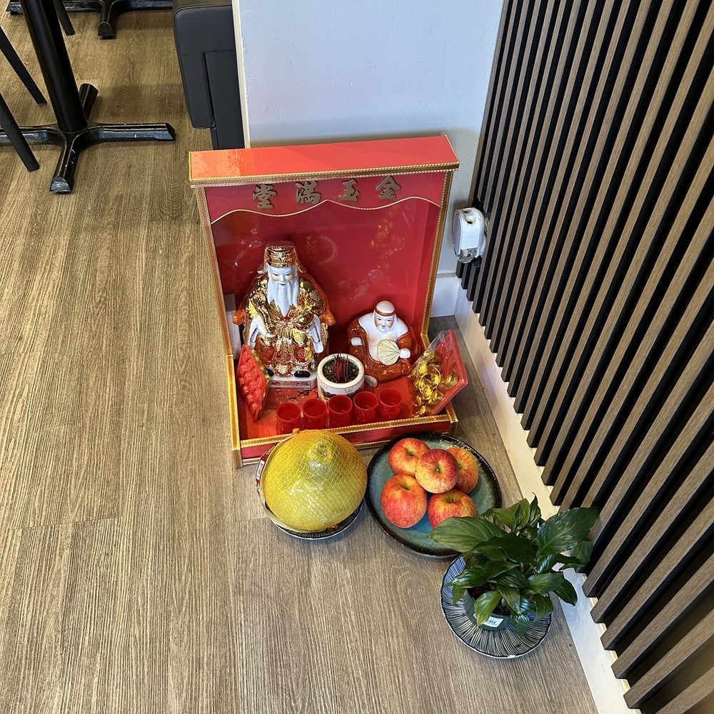 Hai Chi Em Modern Vietnamese Restaurant - small altar with offering of incense, fresh fruits and a potted plant - Vietnamese Near Me - Vancouver, British Columbia Hai Chi Em Modern Vietnamese Restaurant - small altar with offering of incense, fresh fruits and a potted plant - Vietnamese Near Me - Vancouver, British Columbia