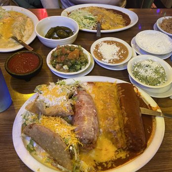 Mi Nidito Restaurant - Center pictured is the "Presidents Plate," top bean enchiladas and top left, chicken enchiladas and all the sides in between. - Mexican Near Me - Tucson, Arizona Mi Nidito Restaurant - Center pictured is the "Presidents Plate," top bean enchiladas and top left, chicken enchiladas and all the sides in between. - Mexican Near Me - Tucson, Arizona