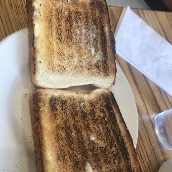 EGGVENTURE CAFE - two slices of toast on a plate - Pancakes Near Me - Minooka, Illinois EGGVENTURE CAFE - two slices of toast on a plate - Pancakes Near Me - Minooka, Illinois