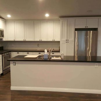 Paradise Homes Construction - kitchen with stainless steel appliances - General Contractors Near Me Paradise Homes Construction - kitchen with stainless steel appliances - General Contractors Near Me