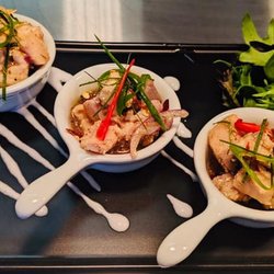 Kwanjai Thai - Kwanjai Salmon Larb Seared salmon pieces with lemon juice, roasted ground rice, mint, coriander and fresh herbs