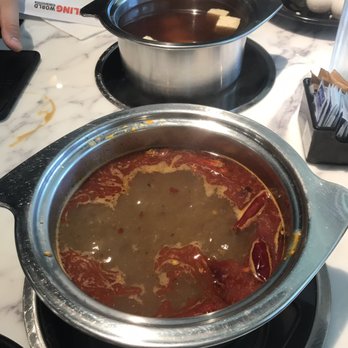 Boiling World - My spicy broth in front and my sons in the back - Hot Pot Near Me - Ontario, California