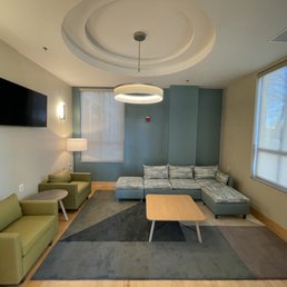 Renovated lounge area, with new lighting, paint, shades, and furniture Renovated lounge area, with new lighting, paint, shades, and furniture
