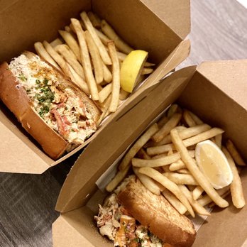 MARKET Seafood Eatery - Clawbster Roll (left) and half Cold Maine Lobster Roll (right) - Seafood Near Me - Edmonds, Washington MARKET Seafood Eatery - Clawbster Roll (left) and half Cold Maine Lobster Roll (right) - Seafood Near Me - Edmonds, Washington