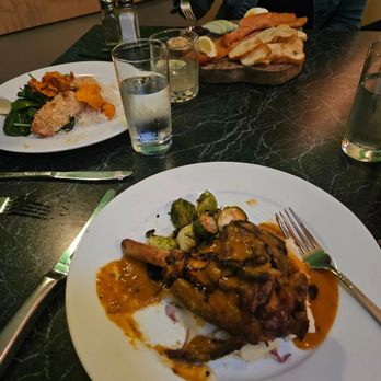 KingFisher - Lamb shank in fore ground, Hawaiain Fish to left, smoked salmon special in back. - Seafood Near Me - Tucson, Arizona KingFisher - Lamb shank in fore ground, Hawaiain Fish to left, smoked salmon special in back. - Seafood Near Me - Tucson, Arizona