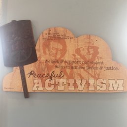 a wooden sign with a hammer on it a wooden sign with a hammer on it