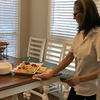 Pristine Clean - Party assistant tidying up the house while having a get together. - Home Cleaning Near Me Pristine Clean - Party assistant tidying up the house while having a get together. - Home Cleaning Near Me